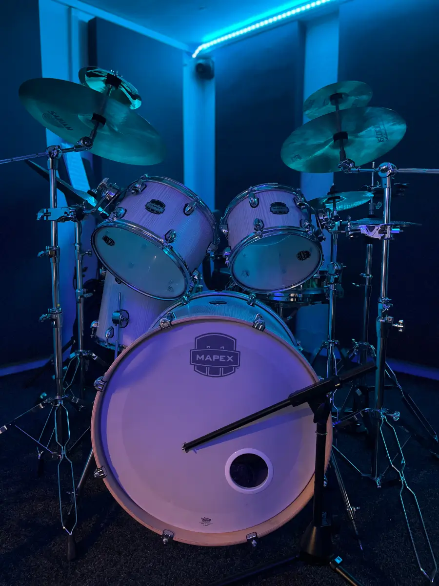 Band performing under studio lights